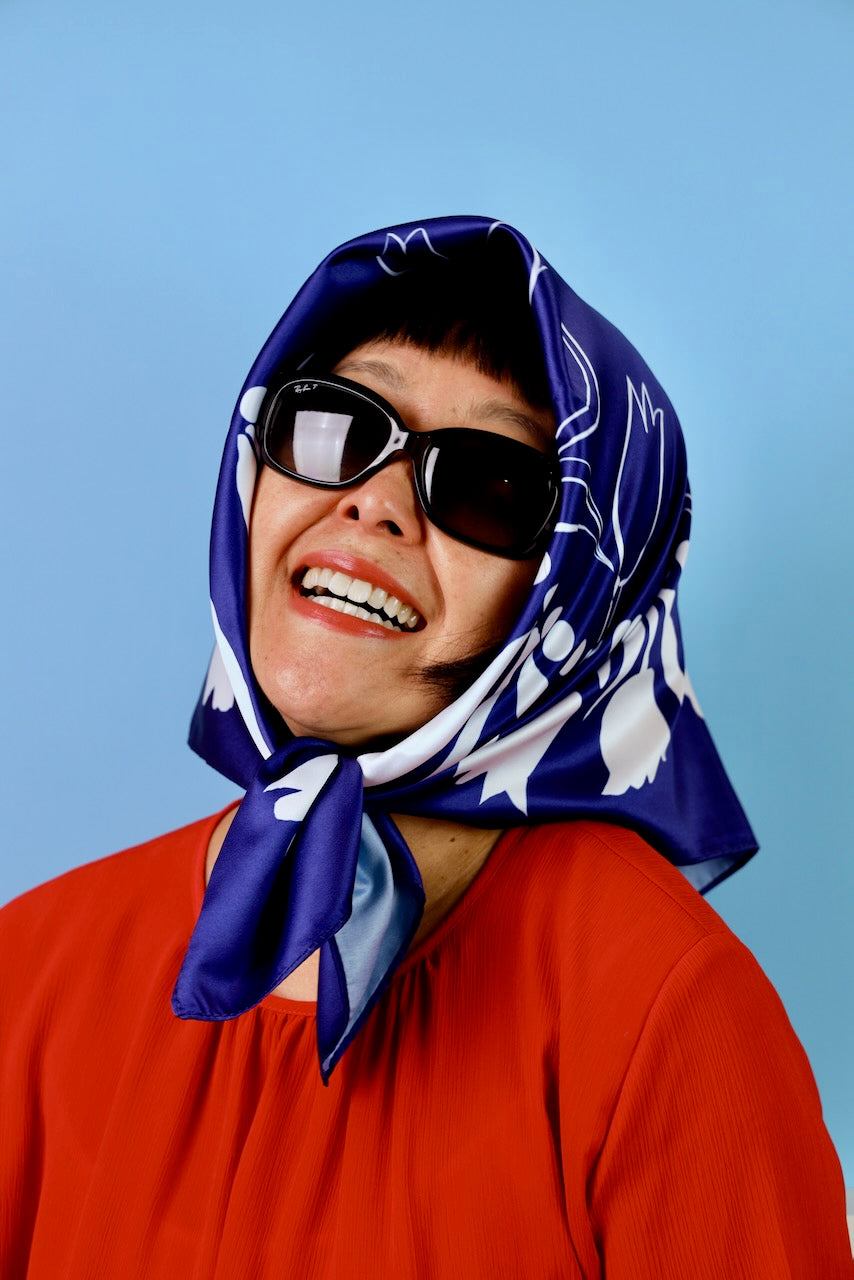 keiko kira wearing head scarf and glasses